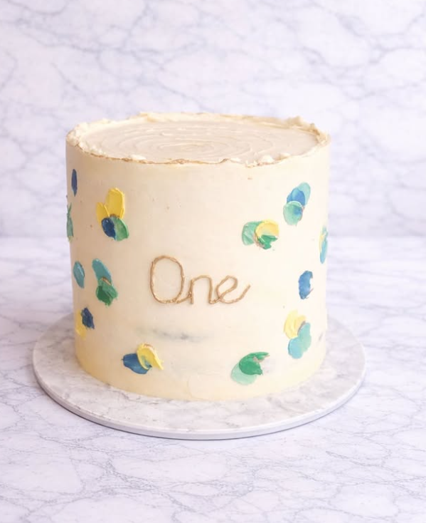 Pastel painted floral first birthday 'One' cake